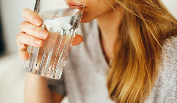 woman drinking glass of water
