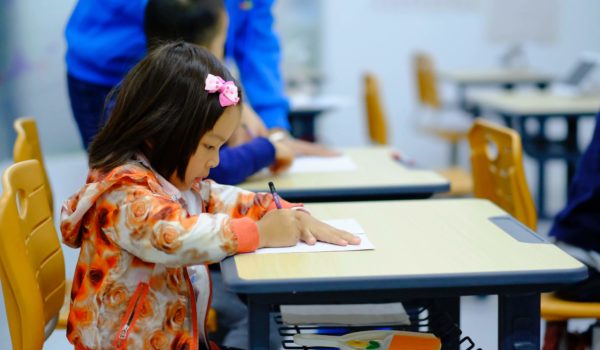 child at desk in school