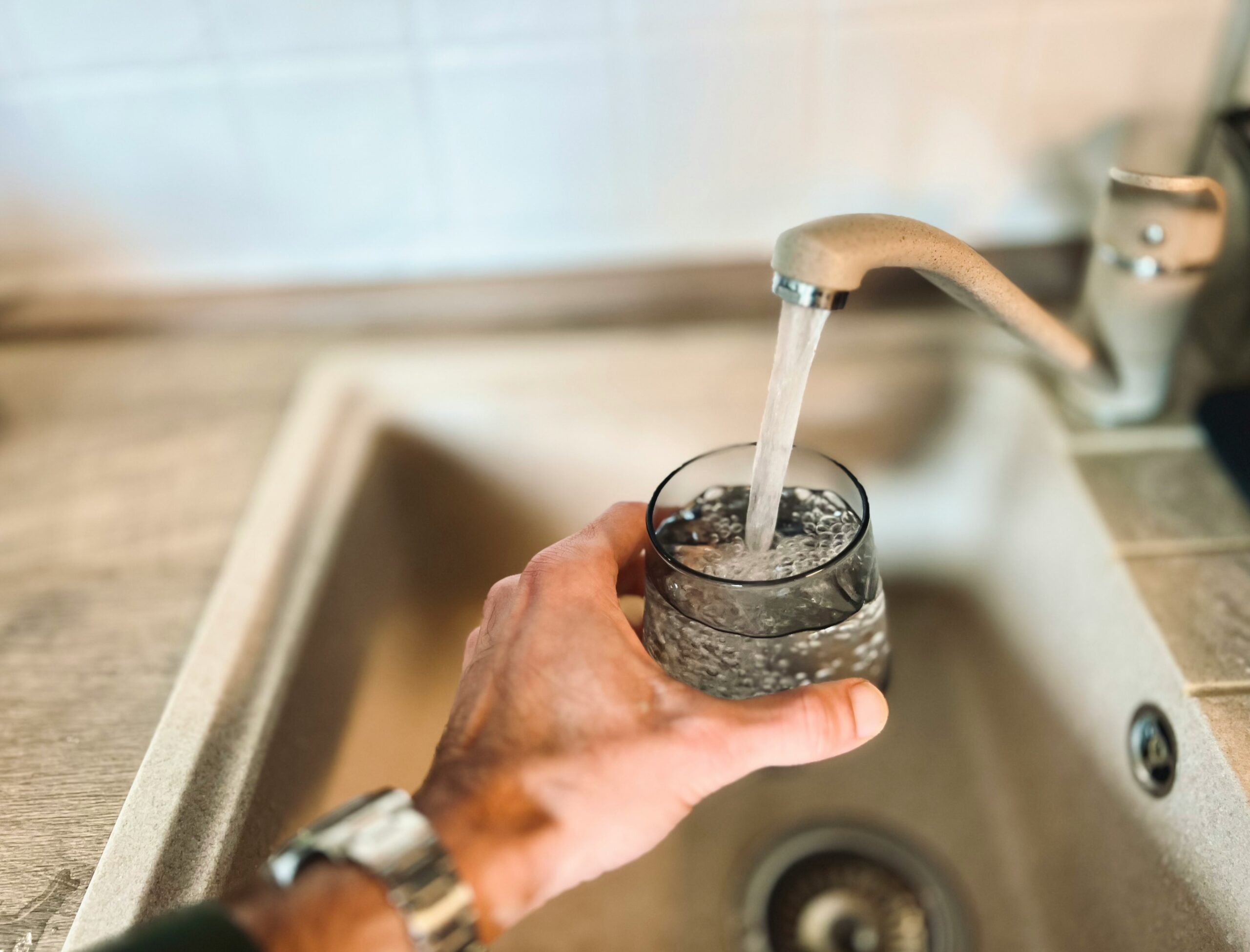 tap water into glass