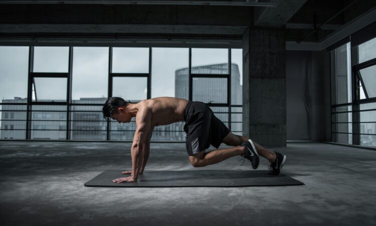 man working out on yoga matt