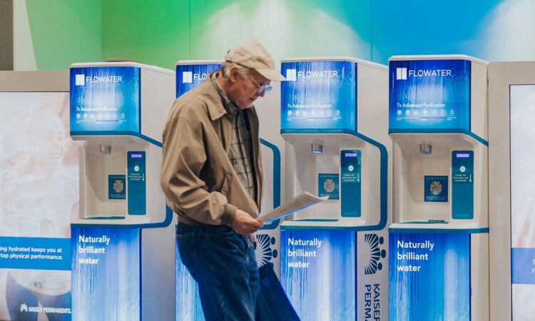 old man walking by refill station