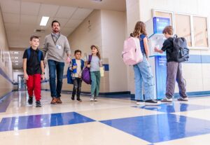 students using FloWater refill station inside school