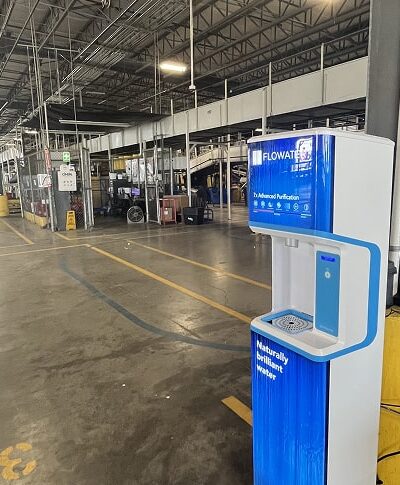 FloWater refill station on concrete floor in warehouse