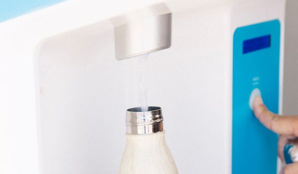white water bottle being filled with Flowater refill station