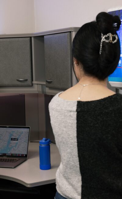 man and woman using FloWater refill station at an office