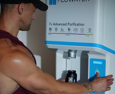 muscular man using refill station