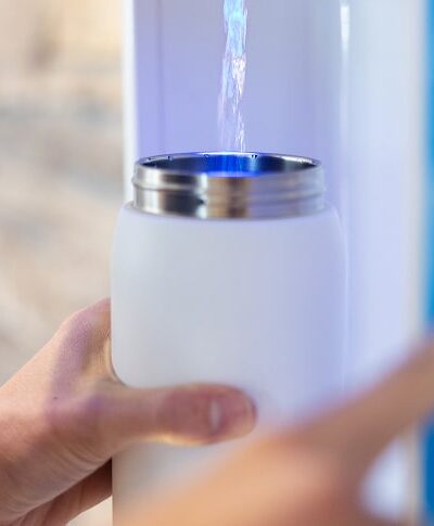 water bottle being refilled by flowater refill station