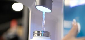 white water bottle being refilled by refill station