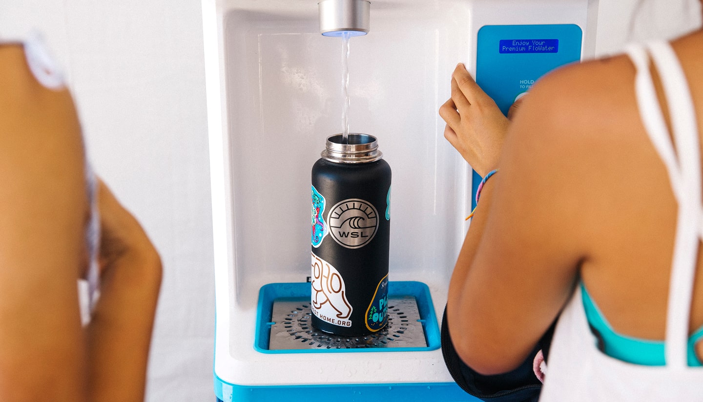 woman using flowater refill station