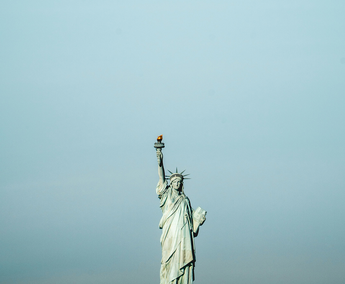statue of liberty on gray sky background