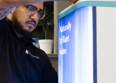 service tech working on a refill station