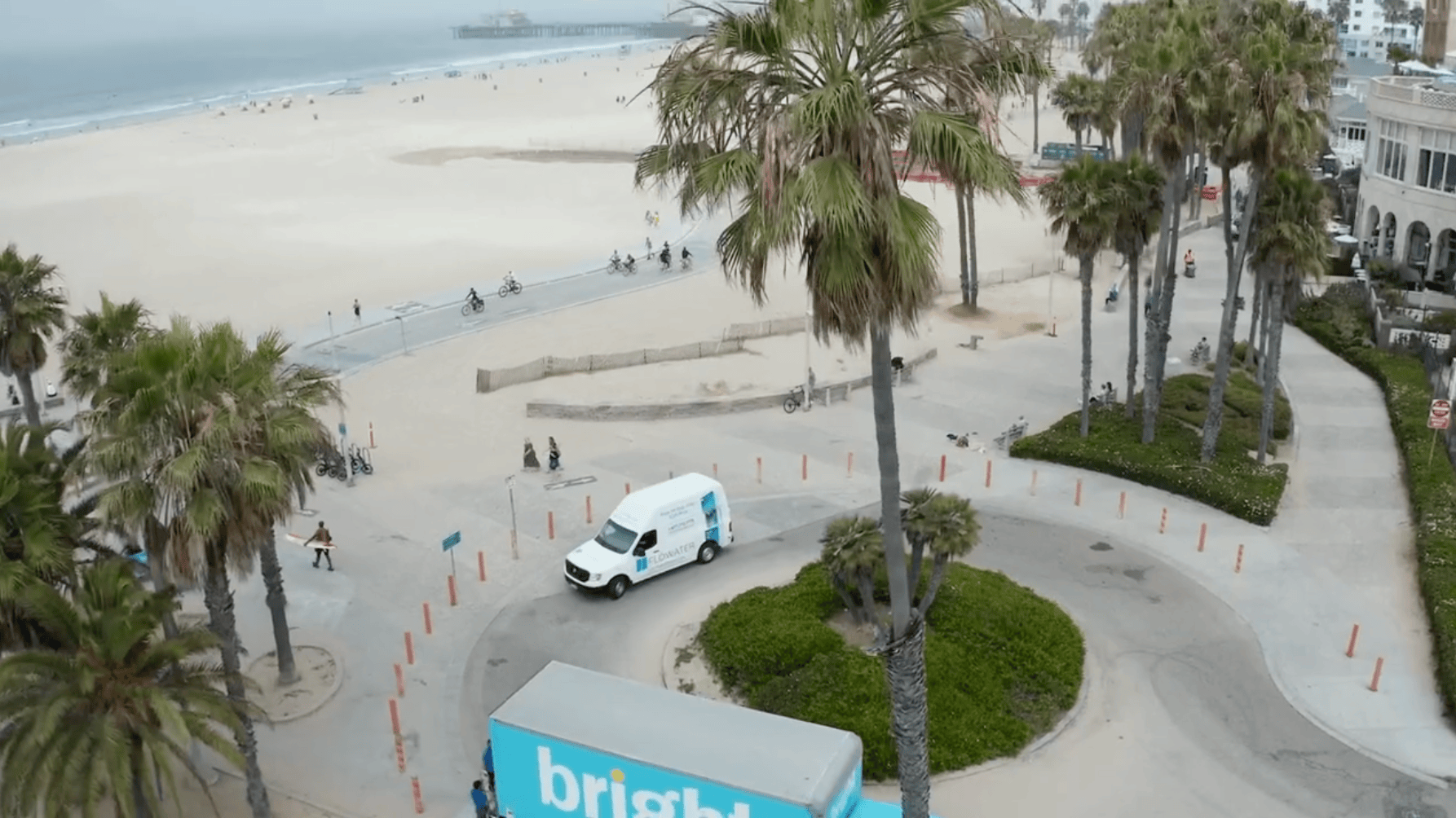 flowater service truck rounding beach corner