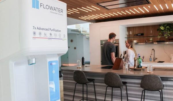 couple chatting near flowater refill station