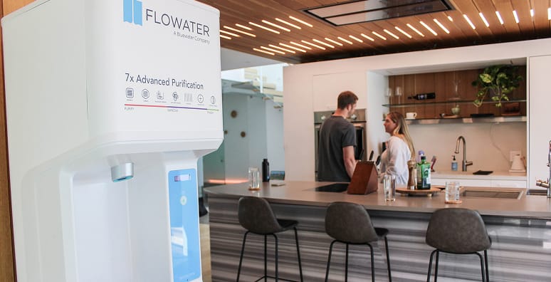 couple chatting near flowater refill station
